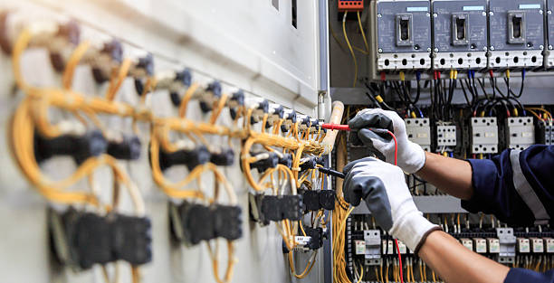 Professional Electrical Panel Upgrade technician working in Palo Alto County County, IA